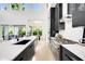 Modern kitchen with sleek cabinetry, quartz countertops, and professional stainless steel appliances at 1805 Goldenrod St, Sarasota, FL 34239
