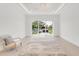 Bright, spacious living room with large sliding glass doors leading to the outside at 1805 Goldenrod St, Sarasota, FL 34239