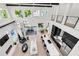 Bright, open-concept living room with a modern fireplace, soaring ceilings, and a view of the gourmet kitchen at 1805 Goldenrod St, Sarasota, FL 34239