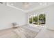 Bright, spacious living room with large sliding glass doors leading to the outside at 1805 Goldenrod St, Sarasota, FL 34239