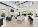 Bright and spacious living room with a fireplace, high ceilings, large windows, and seamless indoor-outdoor living at 1805 Goldenrod St, Sarasota, FL 34239