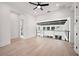 Modern loft with neutral colored walls, hardwood floors, and overlooking balcony at 1805 Goldenrod St, Sarasota, FL 34239