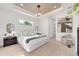 Bright main bedroom featuring modern furniture, lighting fixture, and hardwood floors at 1805 Goldenrod St, Sarasota, FL 34239