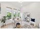 Bright home office with large windows, modern furnishings, and ample natural light at 1805 Goldenrod St, Sarasota, FL 34239