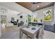 Open-concept dining area with an outdoor grill, seamless indoor-outdoor flow for modern entertaining and relaxation at 1805 Goldenrod St, Sarasota, FL 34239