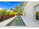 Relaxing pool area with lush greenery, offering a peaceful escape and a refreshing swim in your backyard at 1805 Goldenrod St, Sarasota, FL 34239