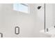Modern shower featuring a glass door, tiled walls, and black hardware at 1805 Goldenrod St, Sarasota, FL 34239