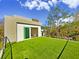 Spacious rooftop deck covered in artificial turf and surrounded by a cable railing at 601 Tremont St, Sarasota, FL 34242