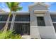 Two-story building with screened balcony and walkway at 12520 Galapagos Ct # 207, Venice, FL 34293
