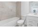 Bathroom with bathtub, toilet and single vanity at 12520 Galapagos Ct # 207, Venice, FL 34293