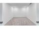 Empty bedroom with gray carpeting and bright white walls at 12520 Galapagos Ct # 207, Venice, FL 34293