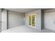 Covered patio with sliding glass doors leading to the kitchen at 12520 Galapagos Ct # 207, Venice, FL 34293