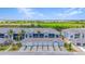 Aerial image showing a row of attached homes with garages at 12520 Galapagos Ct # 207, Venice, FL 34293