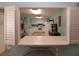 Small community kitchen with white cabinets and appliances at 1213 Tallywood Dr # 7007, Sarasota, FL 34237