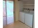Laundry closet with washer, dryer, and exterior access at 1213 Tallywood Dr # 7007, Sarasota, FL 34237
