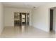 Spacious living room with tile floors and sliding doors at 1213 Tallywood Dr # 7007, Sarasota, FL 34237