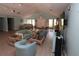 Community room with light teal walls and ample seating for gatherings at 1213 Tallywood Dr # 7007, Sarasota, FL 34237