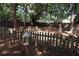 Fenced-in pet area with benches under shade trees at 1213 Tallywood Dr # 7007, Sarasota, FL 34237