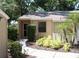 Exterior view of condo with landscaped walkway at 1213 Tallywood Dr # 7007, Sarasota, FL 34237