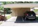 Carport with space for one vehicle and storage at 1213 Tallywood Dr # 7007, Sarasota, FL 34237