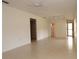 Open living room with tile floors and access to kitchen at 1213 Tallywood Dr # 7007, Sarasota, FL 34237