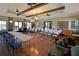 Large community room with hardwood floors and plenty of seating at 1020 Tidewater Shores Loop # 108, Bradenton, FL 34208