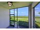 Relaxing screened porch overlooking water at 1020 Tidewater Shores Loop # 108, Bradenton, FL 34208