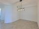 Bright dining room with modern light fixture and tile floor at 1020 Tidewater Shores Loop # 108, Bradenton, FL 34208