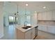Modern kitchen with island, stainless steel appliances, and water views at 1020 Tidewater Shores Loop # 108, Bradenton, FL 34208