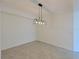 Bright dining room with tile flooring and modern light fixture at 1020 Tidewater Shores Loop # 108, Bradenton, FL 34208