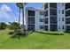 Building exterior showcasing balconies and landscaping at 1020 Tidewater Shores Loop # 108, Bradenton, FL 34208