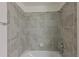 Clean bathroom with tile surround and bathtub at 1020 Tidewater Shores Loop # 108, Bradenton, FL 34208