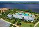 Community clubhouse and pool with waterfront views at 1020 Tidewater Shores Loop # 108, Bradenton, FL 34208