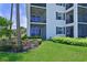 Building exterior with ground floor balcony and landscaping at 1020 Tidewater Shores Loop # 108, Bradenton, FL 34208