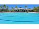 Inviting swimming pool with a large sundeck at 1020 Tidewater Shores Loop # 108, Bradenton, FL 34208