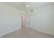 Well-lit bedroom with ceiling fan and double doors to closet at 1020 Tidewater Shores Loop # 108, Bradenton, FL 34208