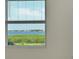 Window view of tranquil water scenery with lush vegetation at 1020 Tidewater Shores Loop # 108, Bradenton, FL 34208