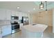 Modern kitchen with stainless steel appliances and island at 1020 Tidewater Shores Loop # 108, Bradenton, FL 34208