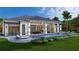 Luxury home with a large pool, outdoor kitchen, and patio at 1800 Webber St, Sarasota, FL 34239