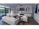Living room with fireplace and large windows at 1800 Webber St, Sarasota, FL 34239