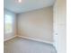 Bright bedroom with carpeted floor, neutral walls, and a window offering natural light at 6163 Mesa Gln, Bradenton, FL 34203