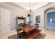 Spacious dining area featuring a wood table and bench at 9033 Allapata Ln, Venice, FL 34293