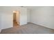 A spacious bedroom with plush carpeting and a walk-in closet at 1643 35Th St, Sarasota, FL 34234