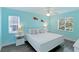 Light and airy bedroom with a king-size bed and light blue walls at 1301 Bay N Dr # 7A, Bradenton Beach, FL 34217