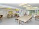 Community workshop with tables, chairs, and natural light at 4350 Chatham Dr # E307, Longboat Key, FL 34228