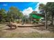 Modern playground with a slide and climbing structures at 4527 S Lockwood Ridge Rd, Sarasota, FL 34231