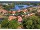 Community overview: Bird's-eye view of houses near a lake at 7360 Oak Moss Dr # 4, Sarasota, FL 34241