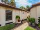 Stone pathway with fountain and greenery creating a tranquil entryway at 7360 Oak Moss Dr # 4, Sarasota, FL 34241