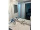 Bathroom with double vanity sinks and a mirror at 4480 Ironwood Cir # 308A, Bradenton, FL 34209