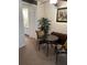 Bright dining area with small table and chairs, offering a view into the kitchen at 4480 Ironwood Cir # 308A, Bradenton, FL 34209